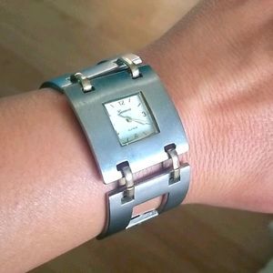 Silver-colored watch with gold-colored accents